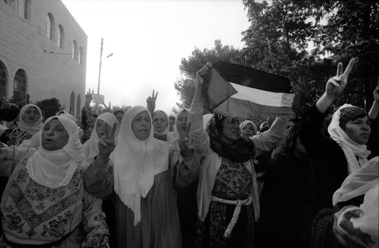 Demonstration outside the cemetery on the day of Eid, Ramallah, 1992, by Joss Dray