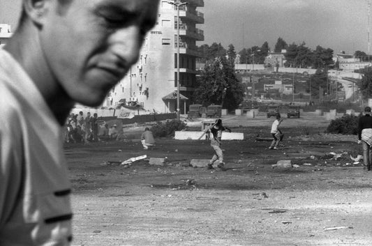 Confrontation with the Israeli army at the one-year anniversary of the 2nd intifada, Ramallah, 2001, by Joss Dray